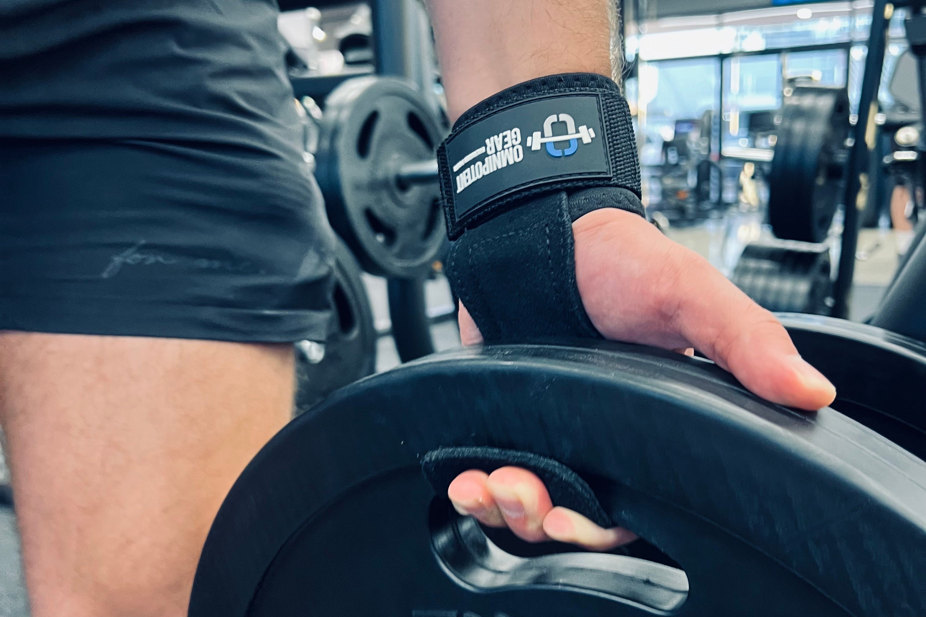 Man using grips to improve grip and protect hand when lifting